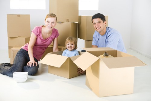 Removal team planning a flat move in Stockwell with boxes and furniture