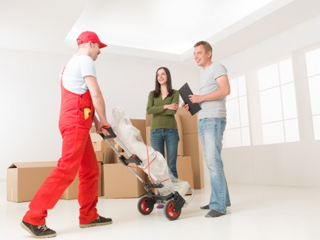 Local removal crew handling boxes and furniture for a Stockwell move