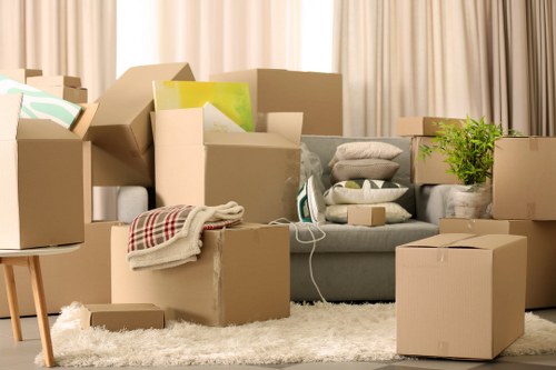 Prepared removals crew arranging boxes and furniture for same day transport